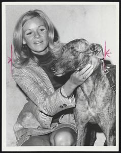 Lucky Dog-Stanno, winner of 1970 Wonderland Derby, is paid visit by Judy Hammar of Worcester before competition for current Countdown at Revere.