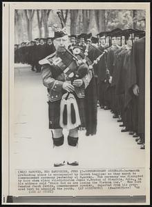 Commencement Serenade- Dartmouth graduating class is accompanied by Scotch bagpiper as they march to commencement ceremony yesterday at Hanover. The ceremony was disrupted by boos when class valedictorian James W. Newton of Glendale, Ariz., in his address said "thank God we are losing the Vietnam War." New York Senator Jacob Javits, commencement speaker, departed from his prepared text to admonish the youth.