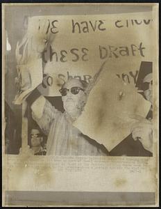 Veteran Martin Goldsmith drops his flaming discharge papers after he lit them as part of local anti-war demonstration 10/16. More than 300 persons gathered in front of the Federal Building where some dozen draft cards were returned to the Government as a protest against the Vietnam war