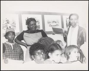 Group of young and older people listening to presentation