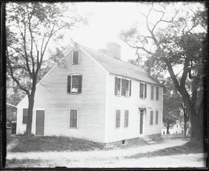 Exterior view of a wooden house with shutters