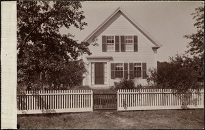 Unidentified house with white fence