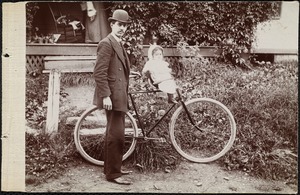 Unidentified man with bike and child