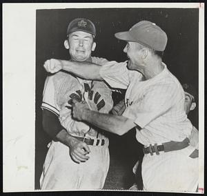 Fighting Manager is former infielder of the Braves and clubs, and now manager of the Corpus Clippers as he lands a right cross to the jaw of Port Arthur Pitcher Billy Bagnell to start a free-for-all at Corpus Christi last night. Bagnell and Ryan were banished. The Clippers won, 9-5.