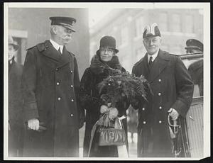 Sponsors Underseas Giant. Mrs. Charles Francis Adams, wife of the Secretary of the Navy, who sponsored the V-5, at the launching of the giant submersible at the navy yard, Portsmouth, N.H., December 17. At her right stands Rear Admiral Charles F. Hughes and, at her left, Rear Admiral William W. Phelps, Commandant of the Portsmouth Navy Yard.