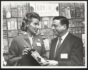 Mrs. Kevin White + former Gov of Ohio Mike DeSalles at the opening of a Boutique at Tremont on the Common. Campaign souvenirs went on sale to support Democratic Presidential campaign fund.