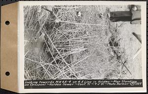 Contract No. 71, WPA Sewer Construction, Holden, looking towards manhole 4A-4 on 4A line in Holden, man standing on cesspool, Holden Sewer, Holden, Mass., Apr. 2, 1941