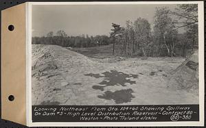 Contract No. 80, High Level Distribution Reservoir, Weston, looking northeast from Sta. 104+60 showing spillway on dam 5, high level distribution reservoir, Weston, Mass., May 29, 1940