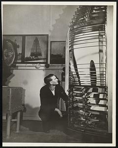 Old Lighthouse Lenses Available on Loan. A Coast Guardsman examines an old-style lighthouse lens. School, museums, and maritime societies may borrow this lens and many other old lenses from the Coast Guard. Because of the change from oil to electricity, other scientific improvements, and modern design, these old lenses, still in excellent condition, have been retired from active service. The Coast Guard will try to give any institution borrowing a lens a picture of the lighthouse where the lens was used and a brief history of it. The lenses are now in storage in various parts of the country. Interested organizations should request further information from Coast Guard Headquarters, Washington, D. C., stating the type and size of lenses desired, and the institution to which the material should be forwarded. The cost of transportation from the Coast Guard storage depots to final destination will have to be borne by the institution requesting the material.
