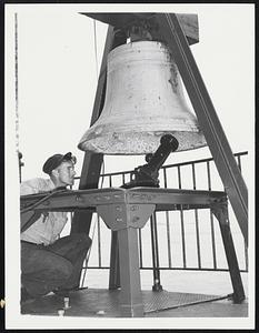 Signal Bell is inspected on Deer Island Light by BM-2.c. Adam C. Jamieson of Medford.