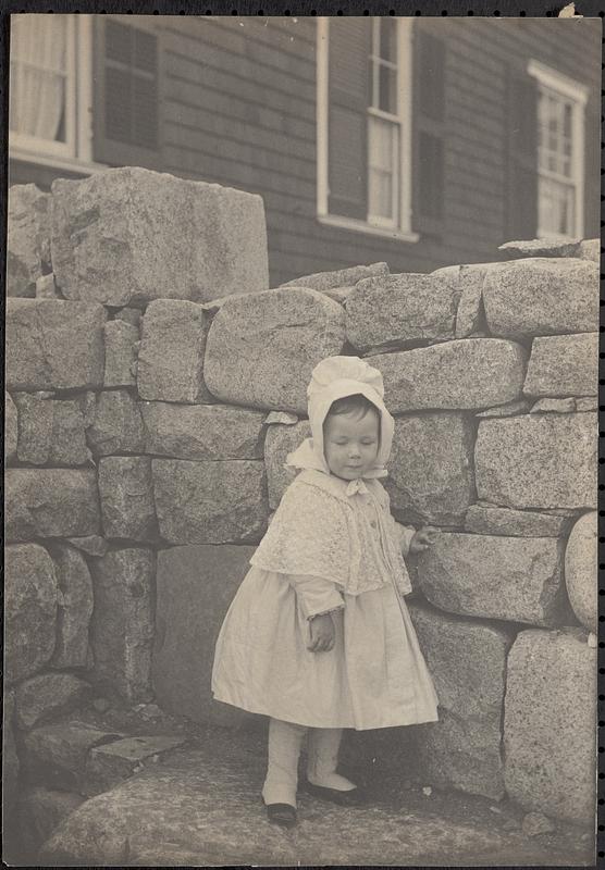 A child beside a wall