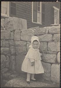 A child beside a wall