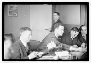 Group of men at table