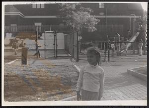 Jeniell standing at a playground