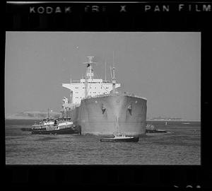 Tugs guide tanker to pier, Northern Avenue, Boston