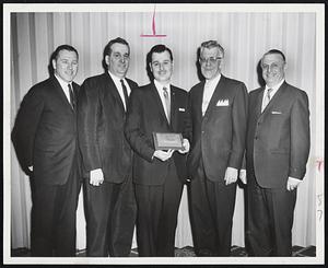 Newton’s Outstanding Young Man of the Year, selected by the Junior Chamber of Commerce, is Herbert A. Abramson, 19 Mayflower Rd., an automobile dealer who is active in community, civic and charitable organizations. Abramson, center, is flanked by Robert Shaw, president of the Jaycees; City Clerk Monte G. Basbas, Mayor Donald Gibbs and Murray E. Sholkin, president of New England Advertising Co.