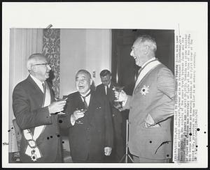 Toast to Peace--Shigeru Yoshida joins with Dean Acheson and Joseph Dodge, left, former aide to President Eisenhower, in a toast today to the signing of the peace treaty between Japan and the United States 10 years ago-- April 28, 1952. Yoshida was prime minister of Japan and Acheson was Secretary of State at the time of the signing. Both Dodge and Acheson are wearing emblems of the First Order of the Rising Sun, presented to them earlier in an embassy ceremony.