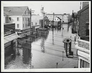Worst of the Flood- Here is a view of Foster St., Peabody, which was flooded the deepest when a mill dam broke last night. The flash flood has left $1 million damage in its wake.