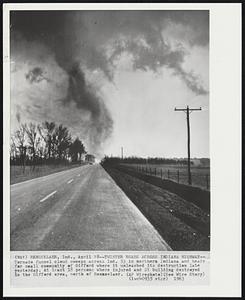 Twister Roars Across Indiana Highway-- Tornado funnel cloud swoops across Ind. 53 in northern Indiana and heads for small community of Gifford where it unleashed its destruction late yesterday. At least 18 persons where injured and 21 buildings destroyed in the Gifford area, north of Rennselaer.