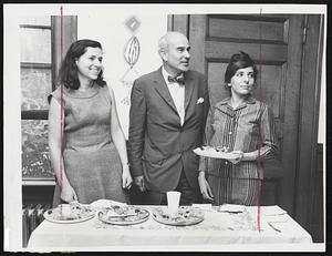 Eat and Run, for the Senate, that is, a way of life for Thomas Boylston Adams shown at the home of Mrs. Gaby Gross, left, of 158 Winthrop Ave., Brookline. The candidate for the Democratic primary for U.S. Senator paused over refreshments with his hostess and Mrs. Martin Sokoloff of 30 Abington Rd., Brookline, in his campaign appearance Tuesday.