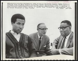 University Park, PA: House of Majority Leader LeRoy Irvis (L) huddles with Dr. Eric Walker, Press. Penn State University (C) and William (Rick) Collens (L) Philadelphia; Press. of the Douglass Association, after a meeting of over 2-hours which Irvis called a "giant step forward" in the problems faced by black students at Penn State.