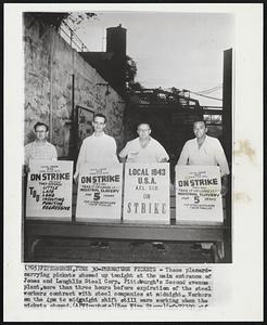Premature Pickets - These placard-carrying pickets showed up tonight at the main entrance of Jones and Laughlin Steel Corp. Pittsburgh's Second avenue plant, more than three hours before expiration of the steel workers contract with steel companies at midnight. Workers on the 4pm to midnight shift still were working when the pickets showed.