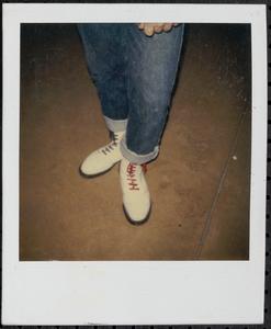 Black and red-laced white boots