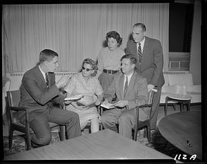 Man reading to group of people