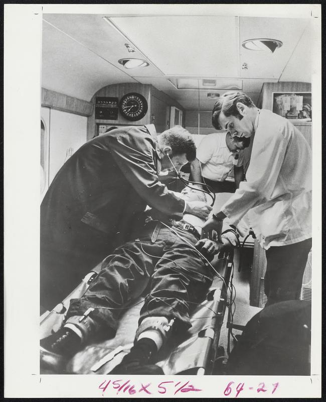 Doctors examine a patient