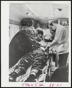 Doctors examine a patient