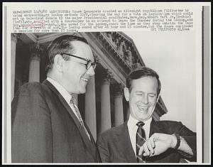 Washington: House Democrats cracked an all-night Republican filibuster by using extraordinary lockup methods 10/9. clearing the way for a vote on legislation which could set up televised debate by the major Presidential candidates. Here, Rep. Robert Taft Jr. (R-Ohio) (left), who scuffled with a doorkeeper in an attempt to leave the Chamber during the lockup, and Rep. Brock Adams (D-Wash.), who moved for the lockup, check the time as they step outside the Capital for a breath of air. The lockup ended after an hour and 45 minutes, but the House continued in session for more than 27 hours.