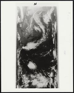 Space Photo of Hurricane Celia.--In total darkness and some 900 miles in space. NASA's Improved TIROS Operational Satellite - 1 (ITOS-1) snapped this infrared photo of Hurricane Celia (circular white mass, lower center) at 4:30 a.m. EDT, August 3, 1970, when the storm was about 200 miles East, southeast of Corpus Christi Texas. Other land marks are the Great Lakes (upper center) and the Eastern Seaboard (right, center). Long white mass extending from Canada into the Midwest is the frontal system which passed through the Washington, D.C., area last evening (August 3, 1970).