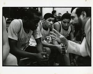 Coach addressing basketball team