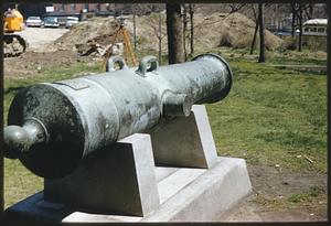 Cannon near construction work and parking lot at Massachusetts State House