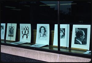 Window displaying framed photographs from Recreation Camera Club, Somerville, Massachusetts