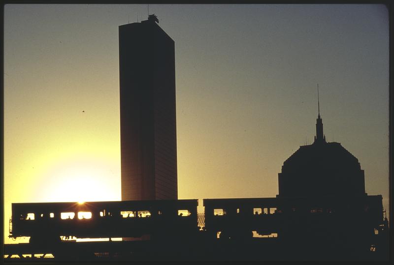 Old and new Hancock Buildings and MBTA Orange Line elevated from South End