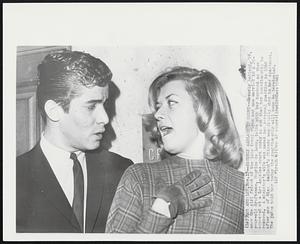 Beverly Aadland in Court--Beverly Aadland, 19, once the girl friend of the late Errol Flynn and now married to a 22-year-old draftsman, Maurice de Leon, talks with her husband as they appeared at a Los Angeles court today to ask that her guardianship be removed. A minister's wife was named her personal guardian in 1960 after one of Miss Aadland's friends was fatally shot in her apartment. The judge told her today the guardianship will soon be terminated.