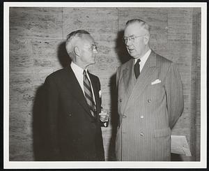 Esso Executive Here-- Frank W. Abrams (left), chairman of the board, Esso Standard Oil Co. of New Jersey, confers with Paul T. Rothwell, president of the Greater Boston Chamber of Commerce, prior to an address yesterday.