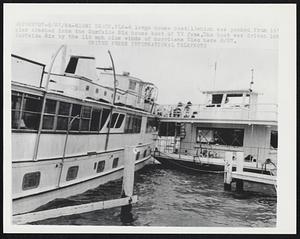 A large house boat (1) which was yanked from it's pier crashed into the Surfside Six house boat of TV fame. The boat was driven into Surfside Six by the 110 mph plus winds of hurricane Cleo here 8/27.