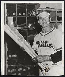 Lookout Andy, They're Loaded- Andy Seminick, slugging catcher of the Phillies, grins happily as he inspects the bats that enabled him to tie the major league record for two runs in one inning Thursday night against the Cincinnati Reds. He had three homers in the game, and yesterday doubled for the winning runs in the second game against the Reds.