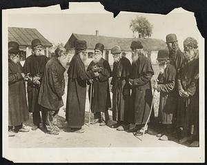 An Unusual Sight in Bessarabia - Photographers Invades Leper Colony on Difficult Assignment. Photo shows: Here is a most curious locality in Rumania, according to the photographers. In order to get this picture, special precaution was taken by the cameraman, due to the fact that the place is probably one of the most contagious spots in Europe. It's the famous leper colony of Valcov in a remote spot of Bessarabia where the inmates mostly are those of the slavic monks. The place is very little known and particularly kept obscure from the knowledge of Western Europe.