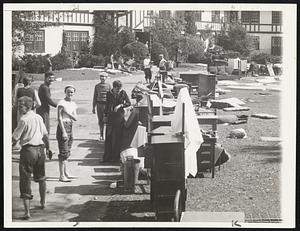 Out to Dry. Tabor Academy students put their furniture out to dry in the school's courtyard Sept. 22 after hurricane had swept over their dormitories the day before. They seemed to think it was fun, too. The academy is at Marion, Mass.