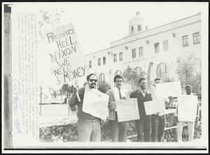 Pickets Form Line at Los Angeles Post office- Signs demanding more money and attacking President Nixon are displayed by pickets at Terminal Annex post office, key distribution point for central Los Angeles, today. Many postal workers refused to cross the picket line, but overall effects of the pickets' action remained uncertain.