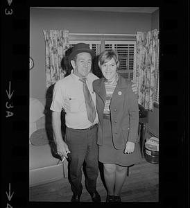 Man with bowler hat and woman celebrating Byron Matthews on election night