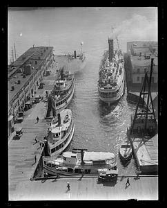 Pleasure fishing boats - old T-Wharf. Excursion steamers: Dorothy Bradford on right, Newcastle left front, Nahant rear left? King Philip - left middle