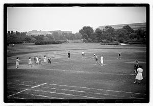 Girls playing a game, possibly kickball