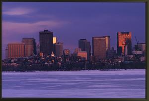 Boston circa 1996: With the Beacon Hill skyline in the background, the winter freezes over the Charles River