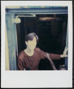 Person standing in a doorway