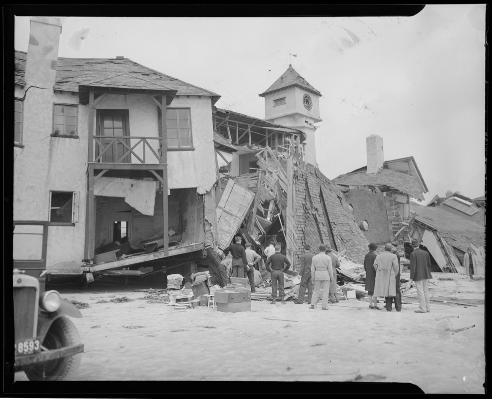 Men examine wrecked building, Hurricane of 38