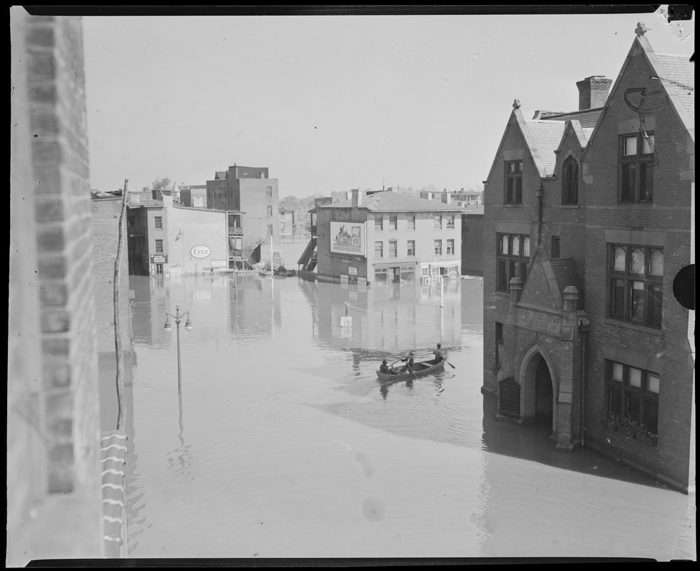 Rowboat on flooded city street, Hurricane of 38